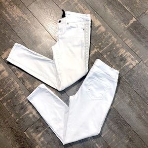 Two pairs of size 4 white denim skinny jeans